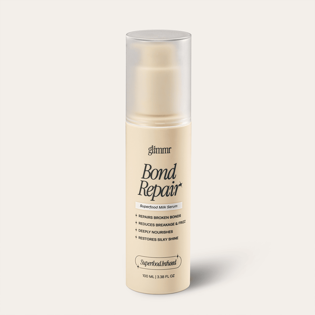 Bottle of Glimmr The Superfood Bond Repair Serum on a white background